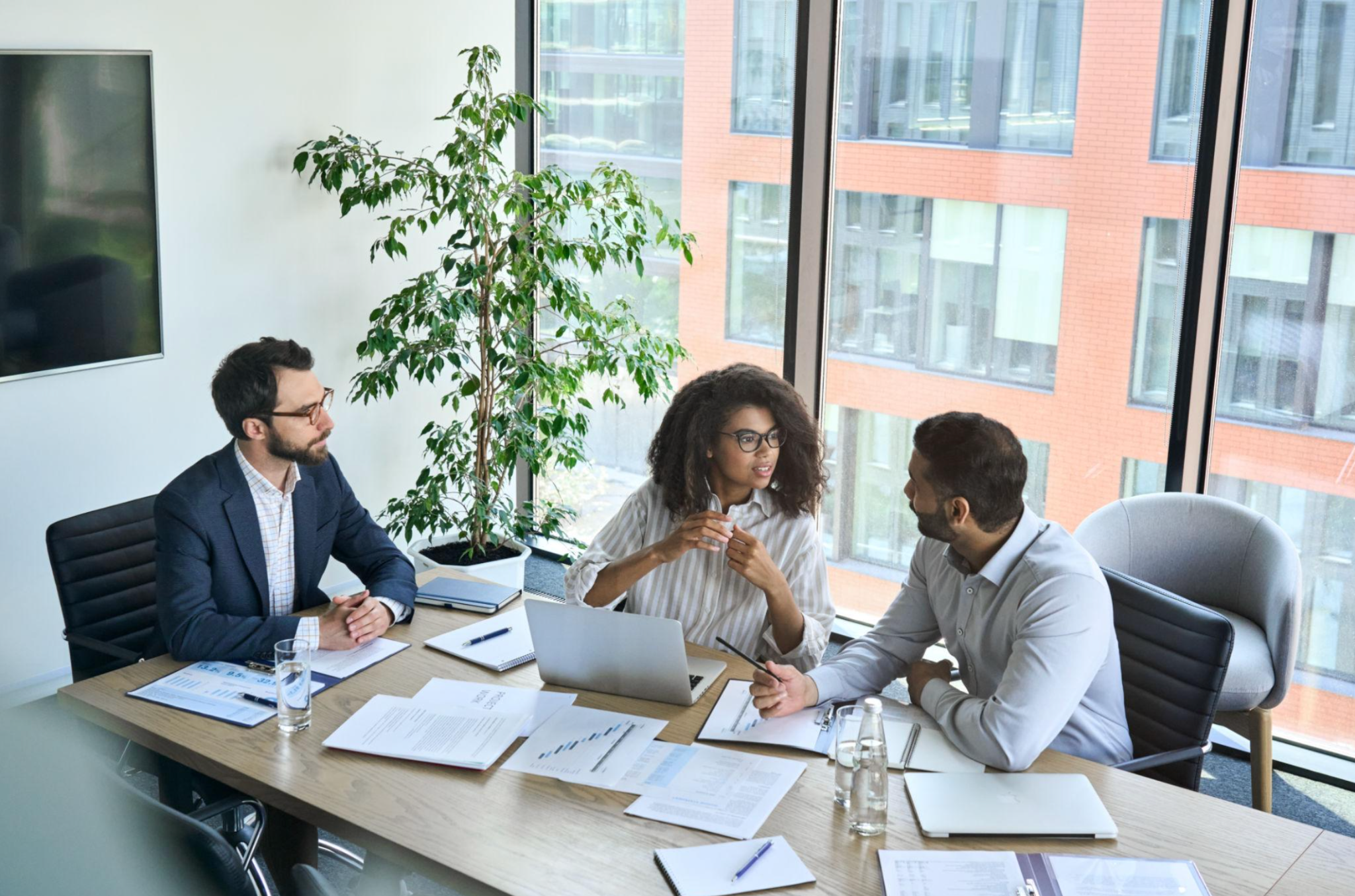 Team discussing strategic collaboration in a modern office